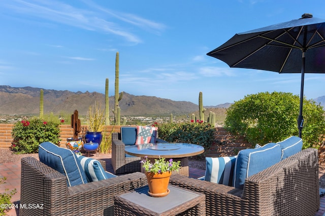 view of patio / terrace featuring outdoor lounge area, outdoor dining area, and a mountain view