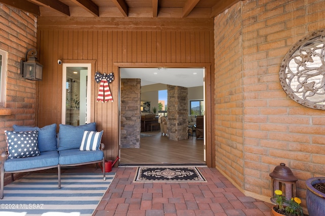 property entrance featuring brick siding