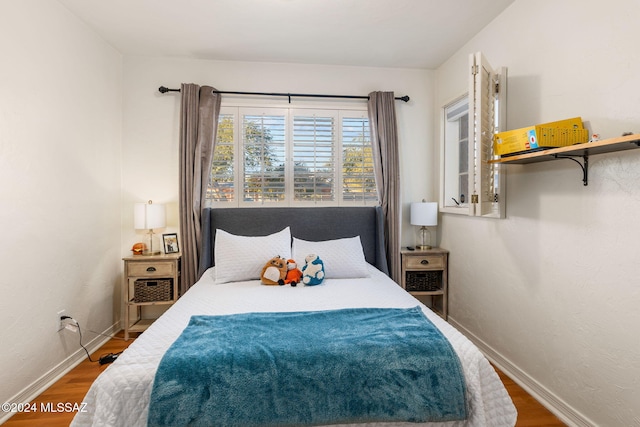 bedroom featuring hardwood / wood-style flooring