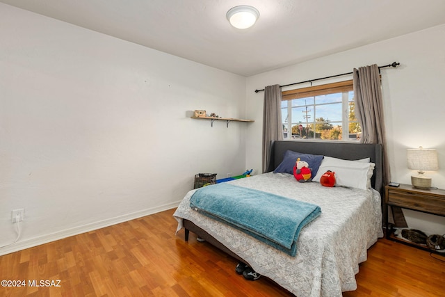 bedroom featuring hardwood / wood-style floors