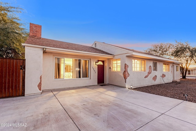 ranch-style home with a patio area