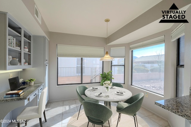 dining area with light tile patterned floors