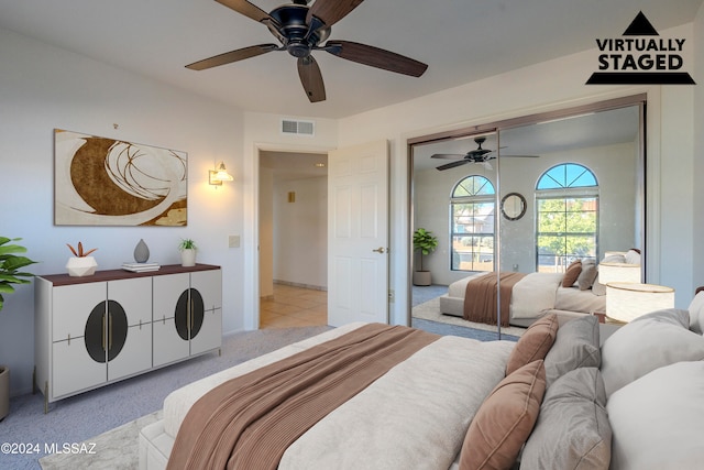 carpeted bedroom with ceiling fan