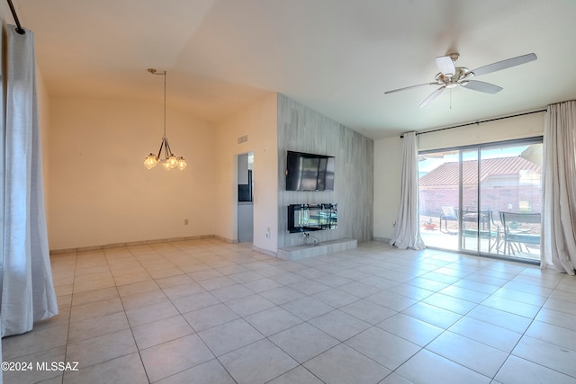 unfurnished living room with ceiling fan with notable chandelier, heating unit, vaulted ceiling, light tile patterned floors, and a fireplace