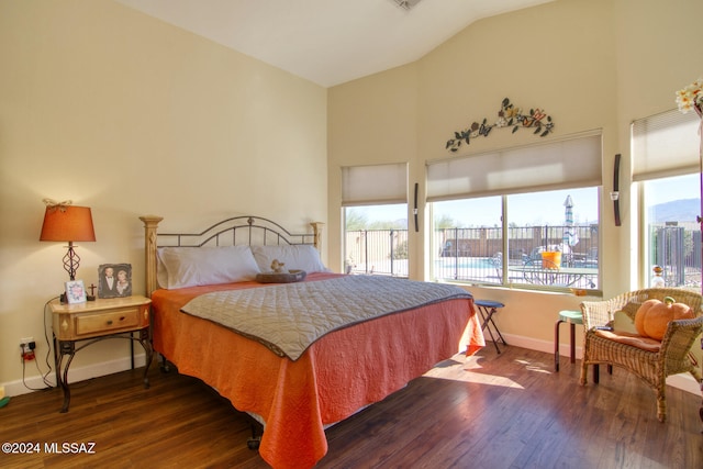 bedroom featuring dark hardwood / wood-style flooring and vaulted ceiling