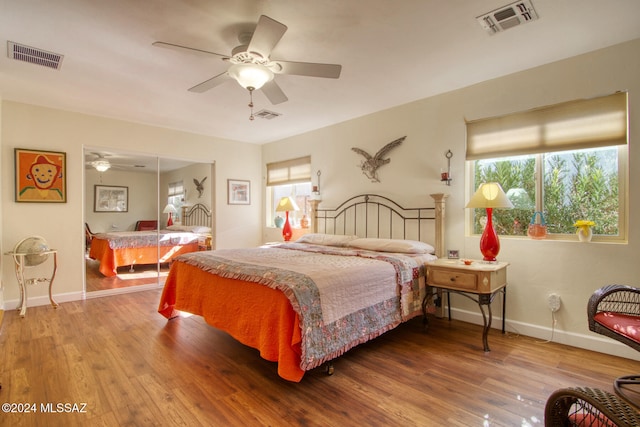 bedroom featuring hardwood / wood-style flooring and ceiling fan