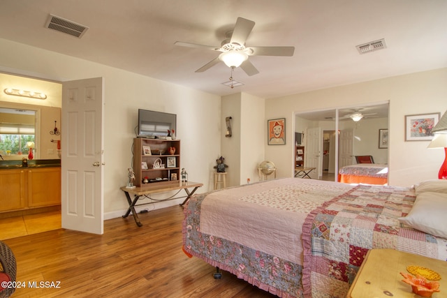 bedroom featuring hardwood / wood-style flooring and ceiling fan