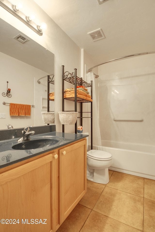 full bathroom featuring shower / bath combo with shower curtain, tile patterned flooring, vanity, and toilet