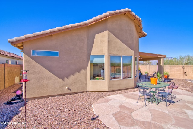 rear view of house with a patio area