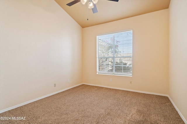 carpeted empty room featuring lofted ceiling and ceiling fan