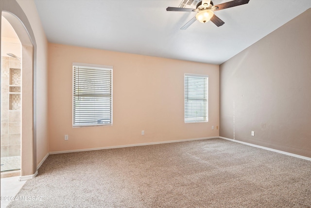 carpeted empty room featuring ceiling fan