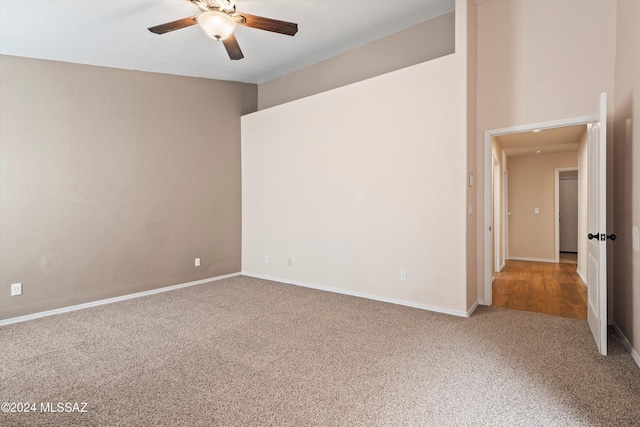 unfurnished room with carpet and ceiling fan