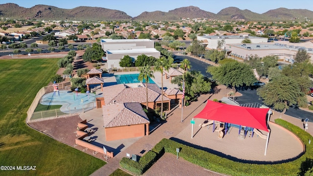 birds eye view of property with a mountain view