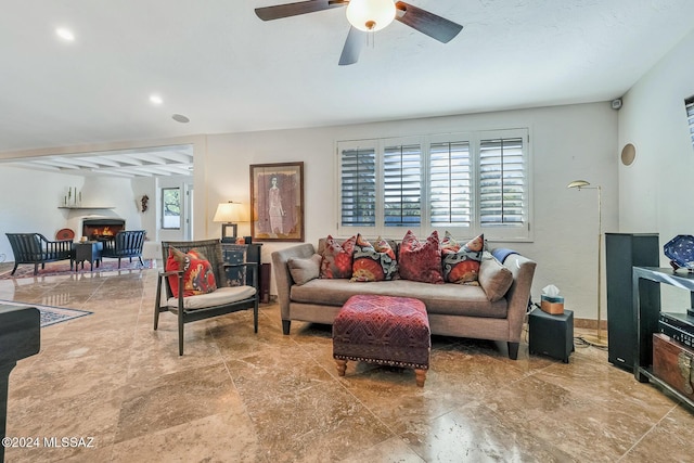 living room featuring beam ceiling and ceiling fan