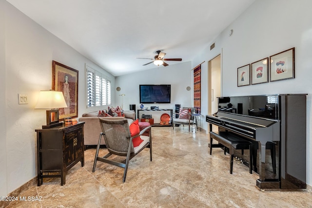 living room with ceiling fan and vaulted ceiling