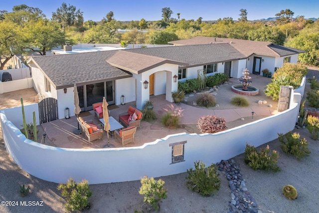 rear view of house with a patio area