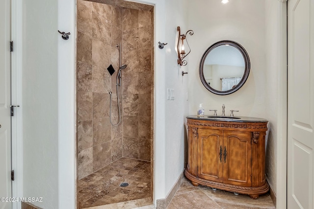 bathroom featuring vanity and a tile shower