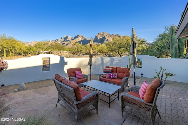 view of patio featuring a mountain view and an outdoor hangout area