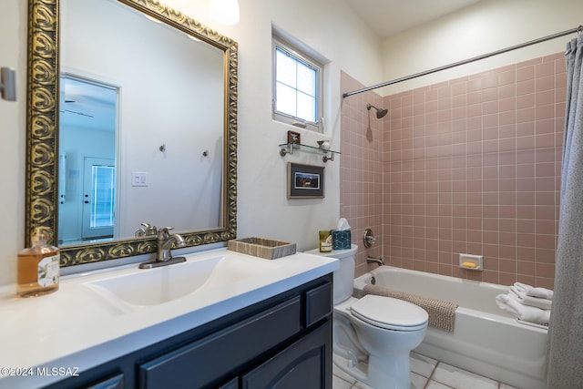 full bathroom with tile patterned floors, vanity, toilet, and tiled shower / bath