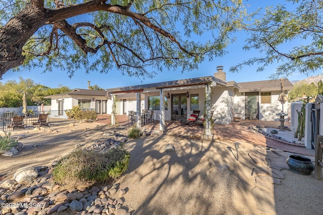 rear view of property with a patio