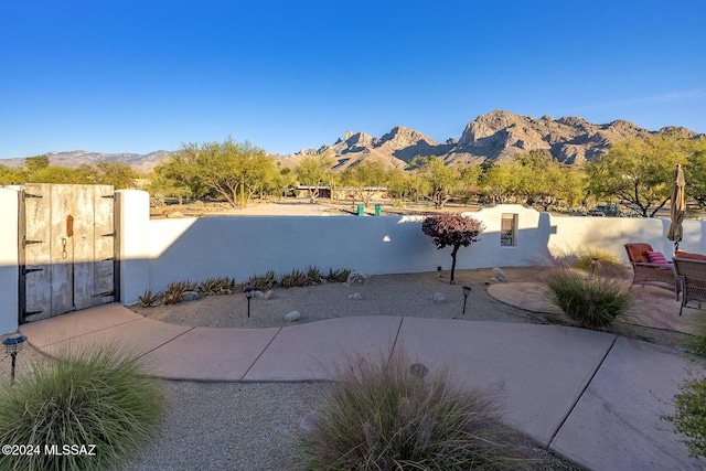 view of patio / terrace with a mountain view