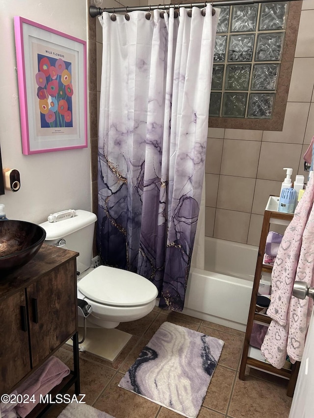 full bathroom featuring shower / tub combo with curtain, sink, tile patterned floors, and toilet