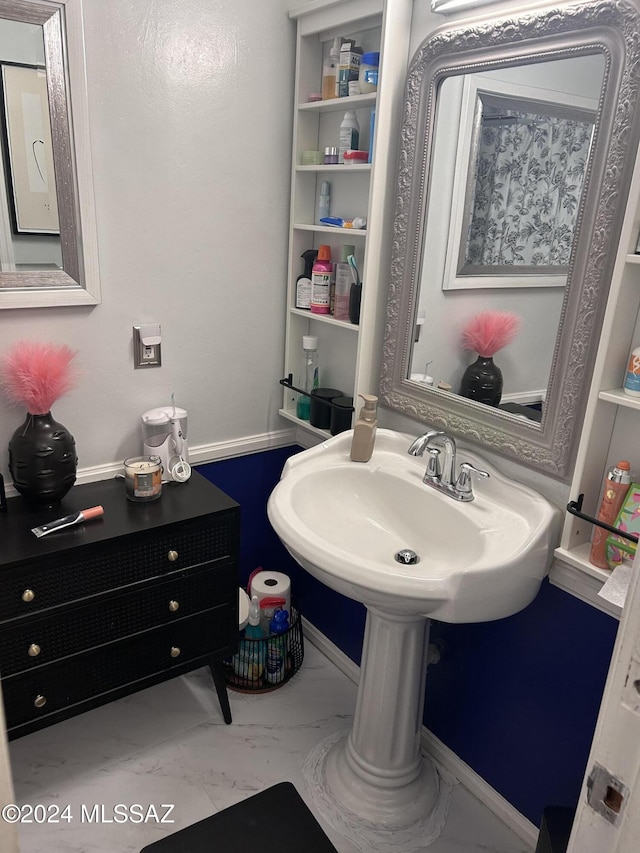 bathroom with sink and built in features