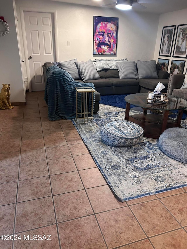 tiled living room with ceiling fan