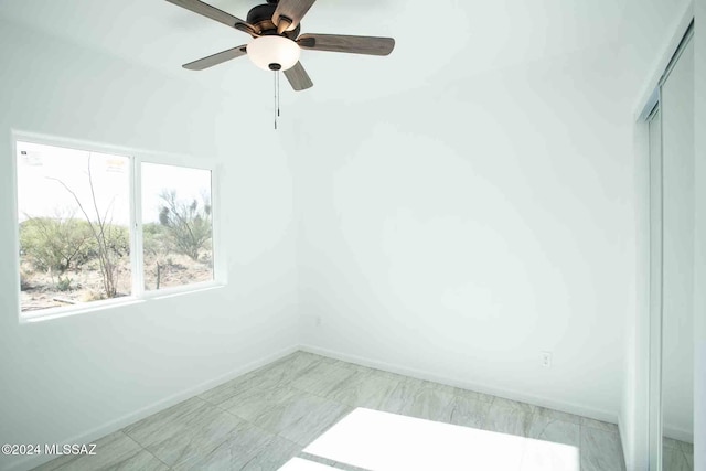 empty room featuring ceiling fan