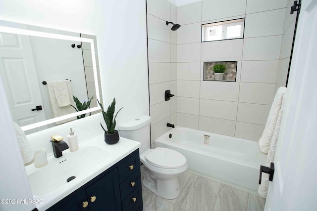 full bathroom with vanity, toilet, and tiled shower / bath