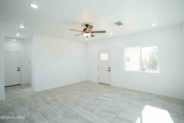 spare room featuring ceiling fan