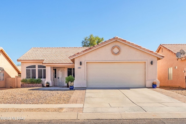 view of front of property with a garage