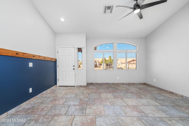 foyer entrance featuring ceiling fan