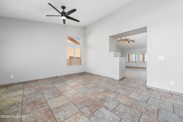 unfurnished room featuring ceiling fan and vaulted ceiling