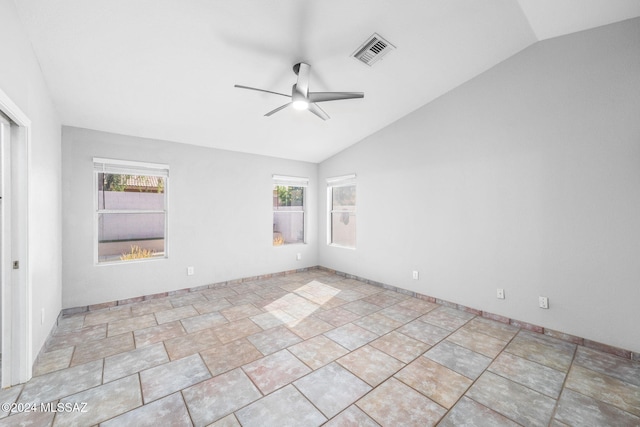 empty room featuring ceiling fan and lofted ceiling