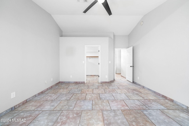 spare room featuring ceiling fan and lofted ceiling