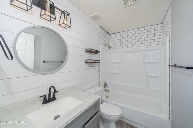 full bathroom with shower / bathing tub combination, vanity, toilet, and wooden walls