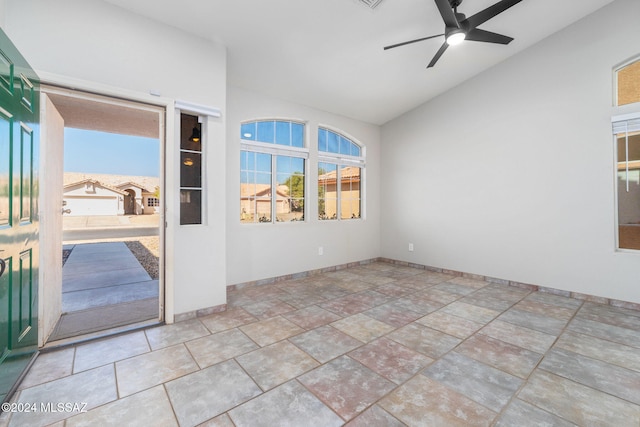 unfurnished room with ceiling fan and lofted ceiling