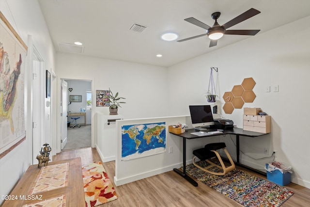 office area featuring light hardwood / wood-style flooring and ceiling fan