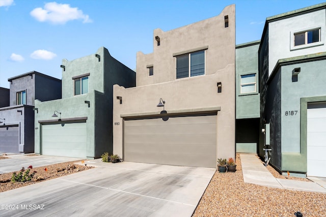 southwest-style home featuring a garage