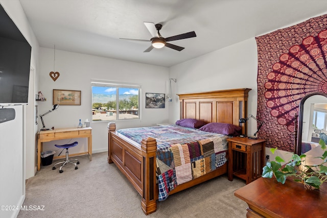 bedroom with light colored carpet and ceiling fan