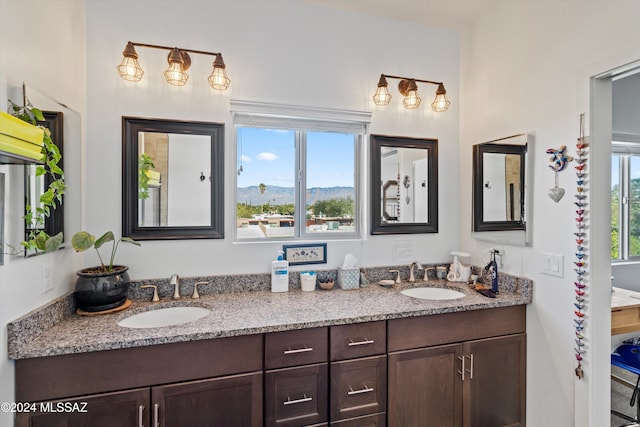 bathroom with a mountain view and vanity