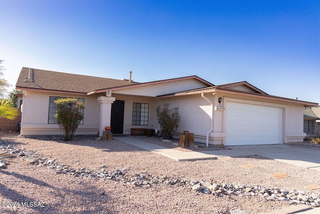 ranch-style home with a garage