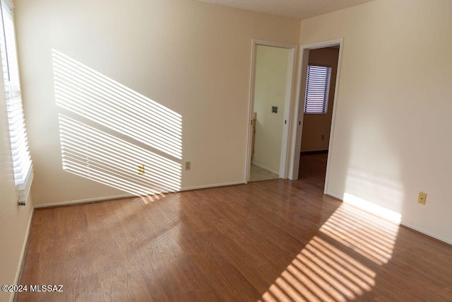 empty room featuring hardwood / wood-style floors