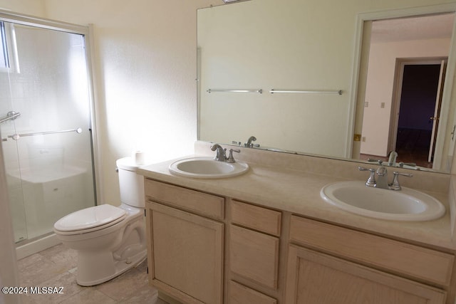 bathroom featuring walk in shower, tile patterned floors, vanity, and toilet