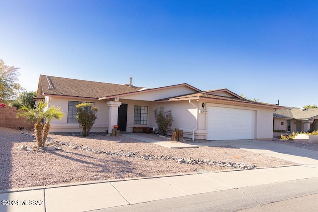 ranch-style home with a garage