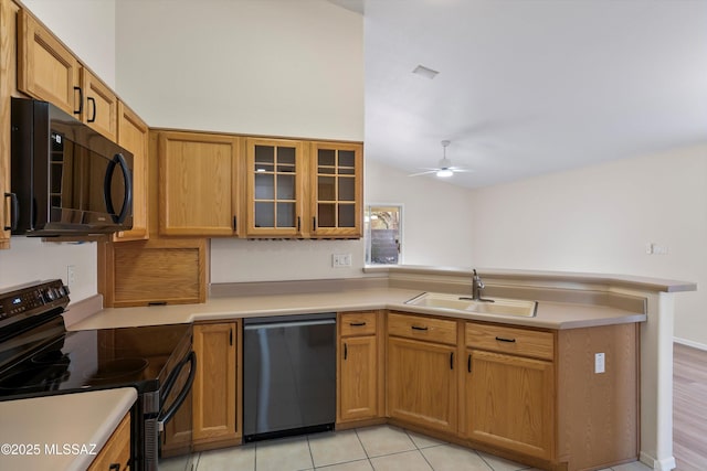 kitchen with black appliances, sink, kitchen peninsula, ceiling fan, and light tile patterned floors