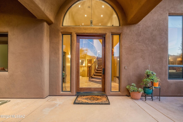 property entrance with a patio area