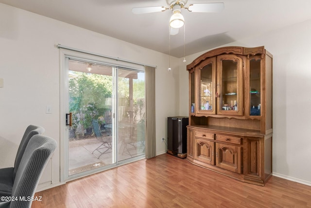 doorway featuring ceiling fan and light wood-type flooring