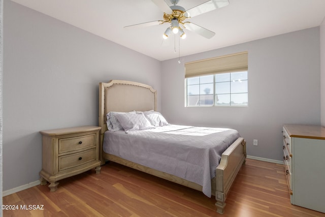 bedroom featuring ceiling fan and light hardwood / wood-style flooring